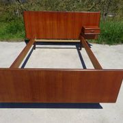 Vintage bed in teak with integrated bedside table.
