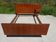 Vintage bed in teak with integrated bedside table.