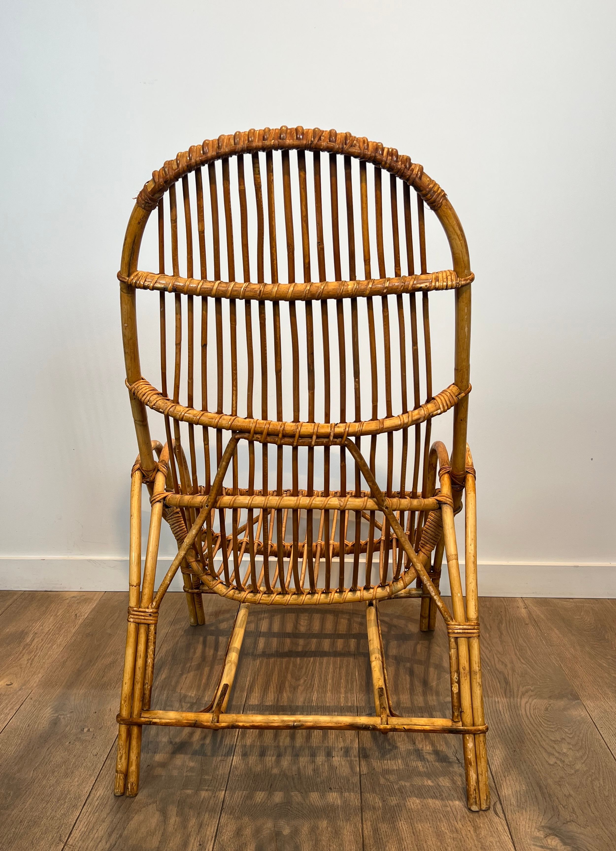 Pair of designer armchairs in rattan