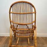 Pair of designer armchairs in rattan
