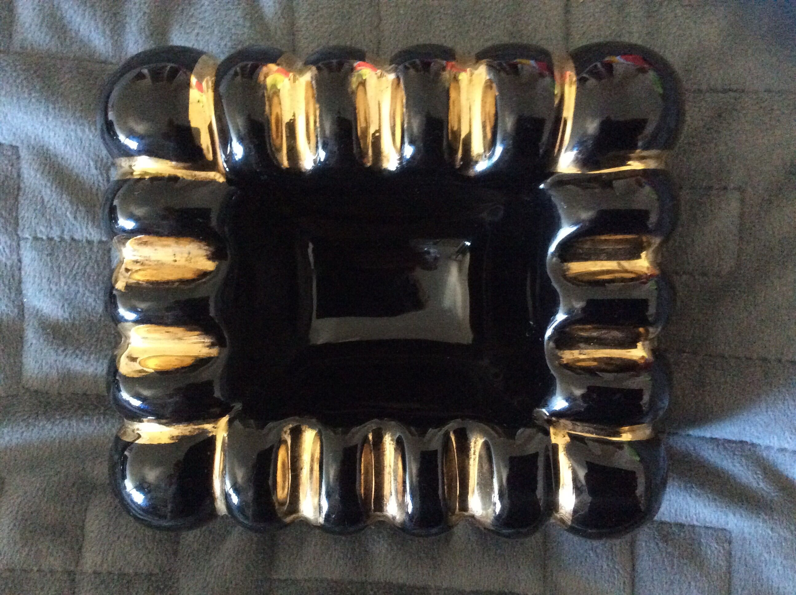 Black ashtray and ceramic gold 50s