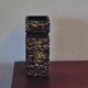 Vintage brown vase in yellow relief.