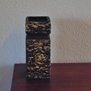 Vintage brown vase in yellow relief.