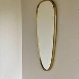 Vintage brass mirror in rear-view mirror shape