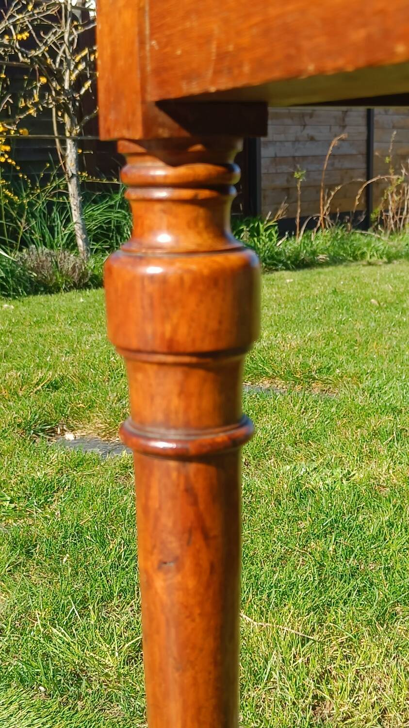Antique solid wood table with a through drawer.
