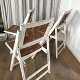 4 folding chairs with wicker seating