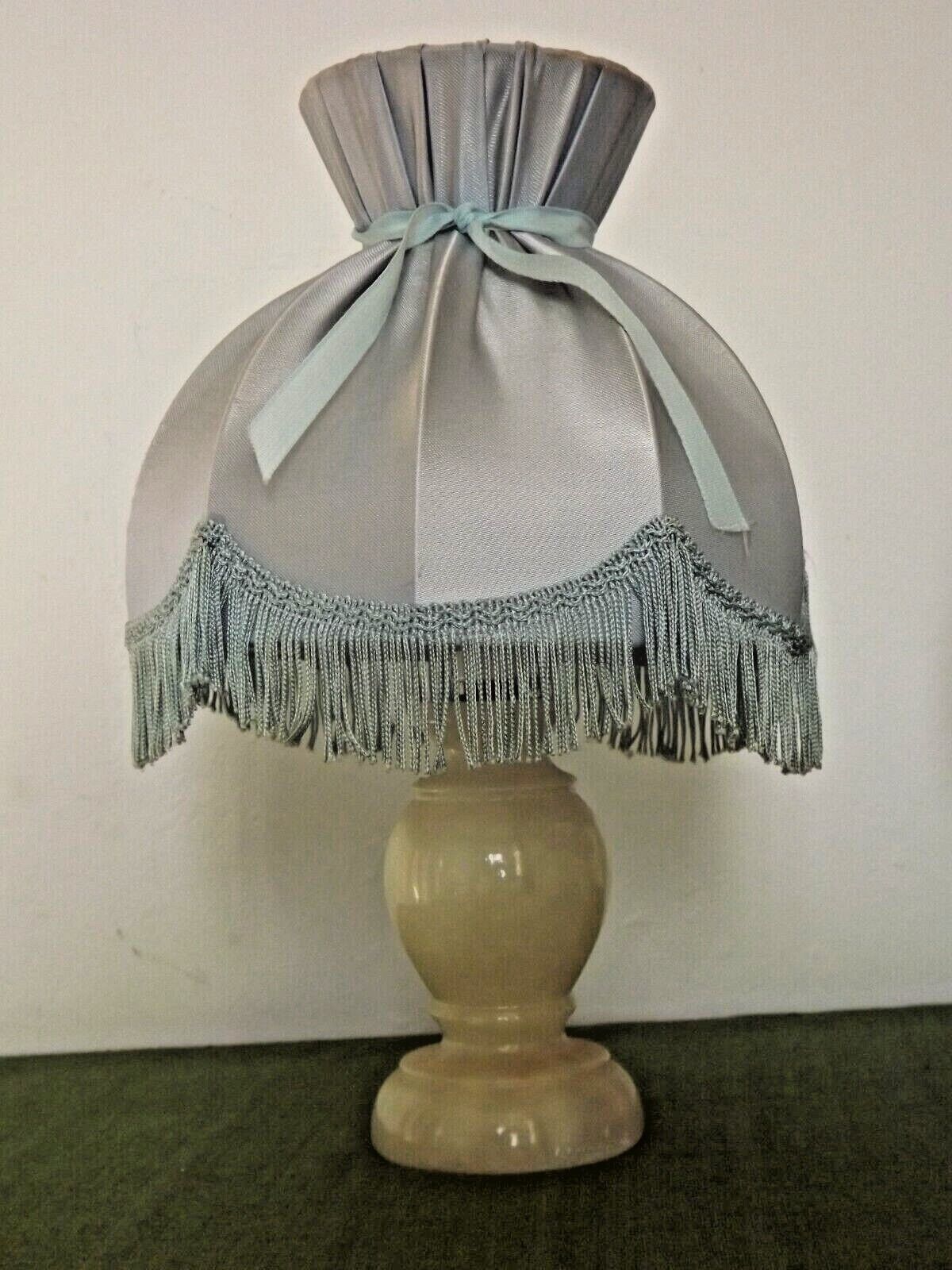 Pair of marble bedside lamps with blue satin fringed shades