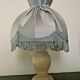 Pair of marble bedside lamps with blue satin fringed shades
