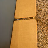 A pair of rattan bedside tables.