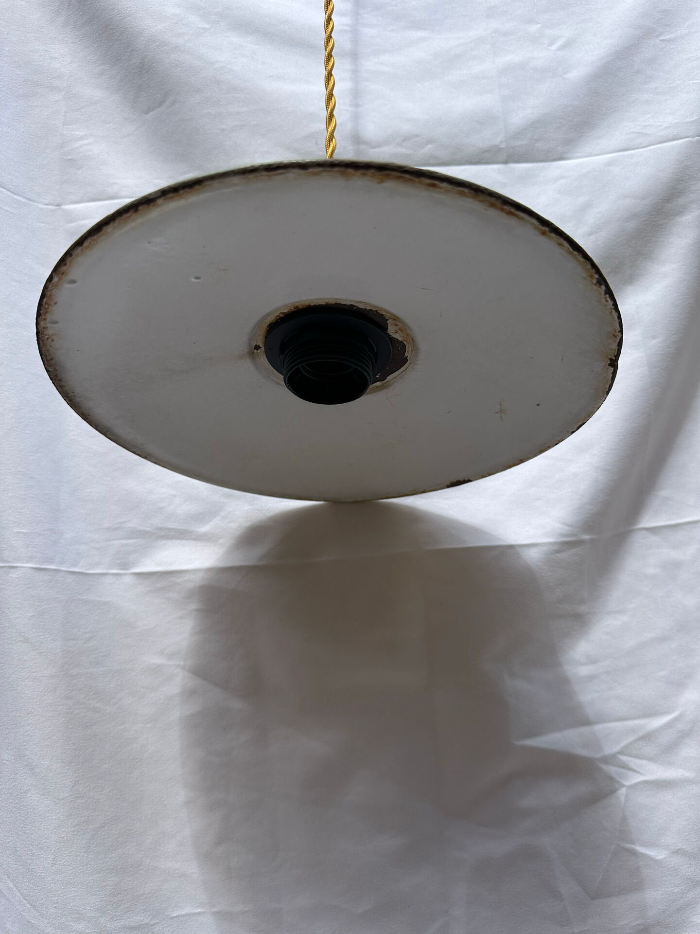 Old green and white enamelled sheet metal suspension