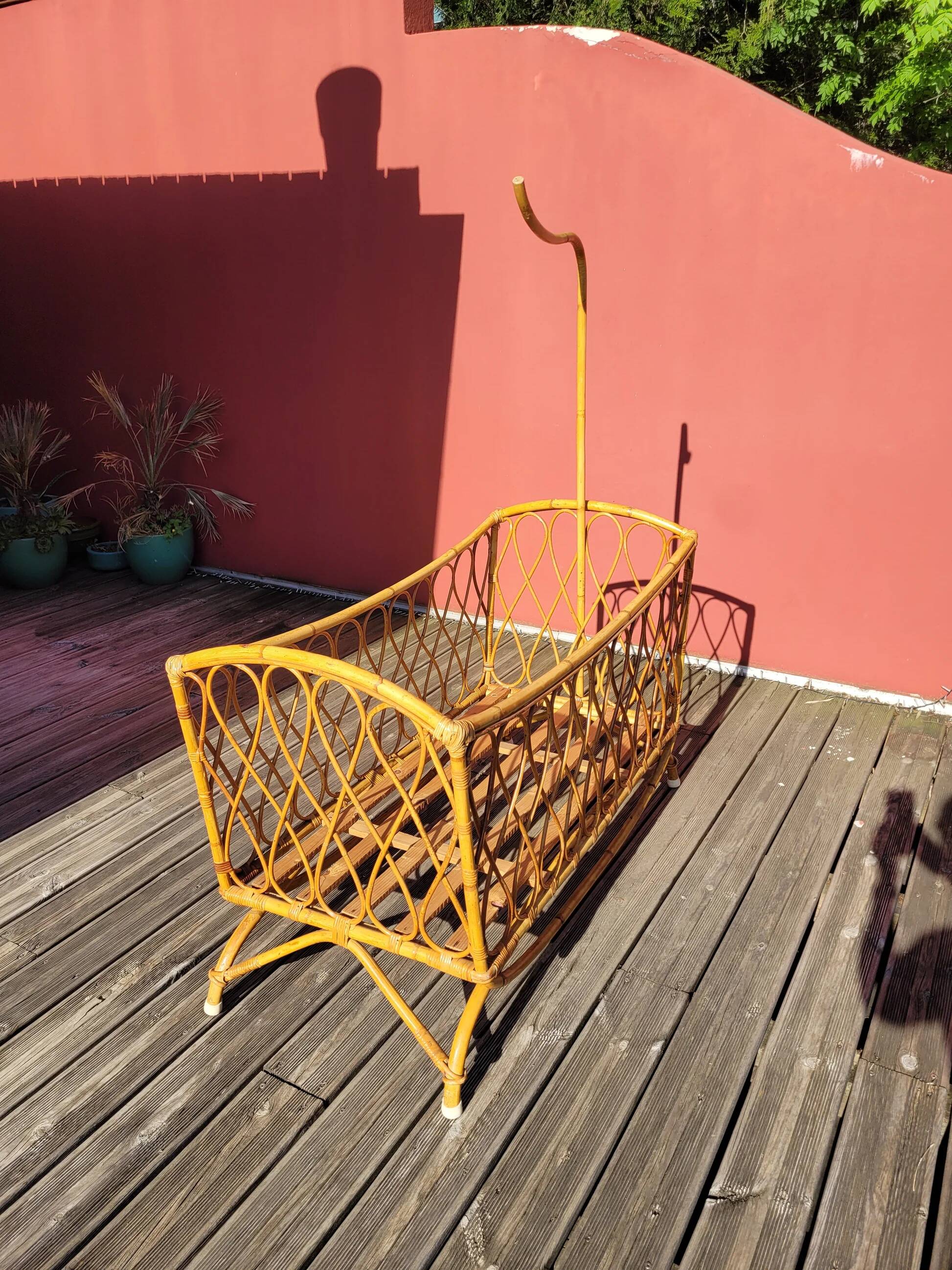 Bamboo and rattan baby cot with canopy.