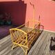 Bamboo and rattan baby cot with canopy.