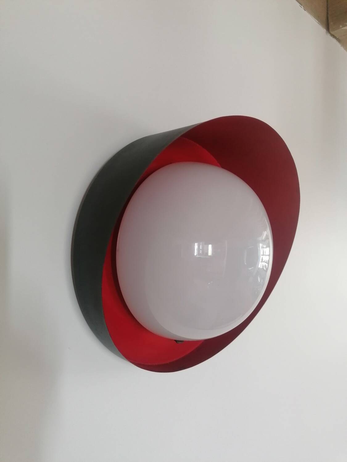 Metal wall light with glass globe