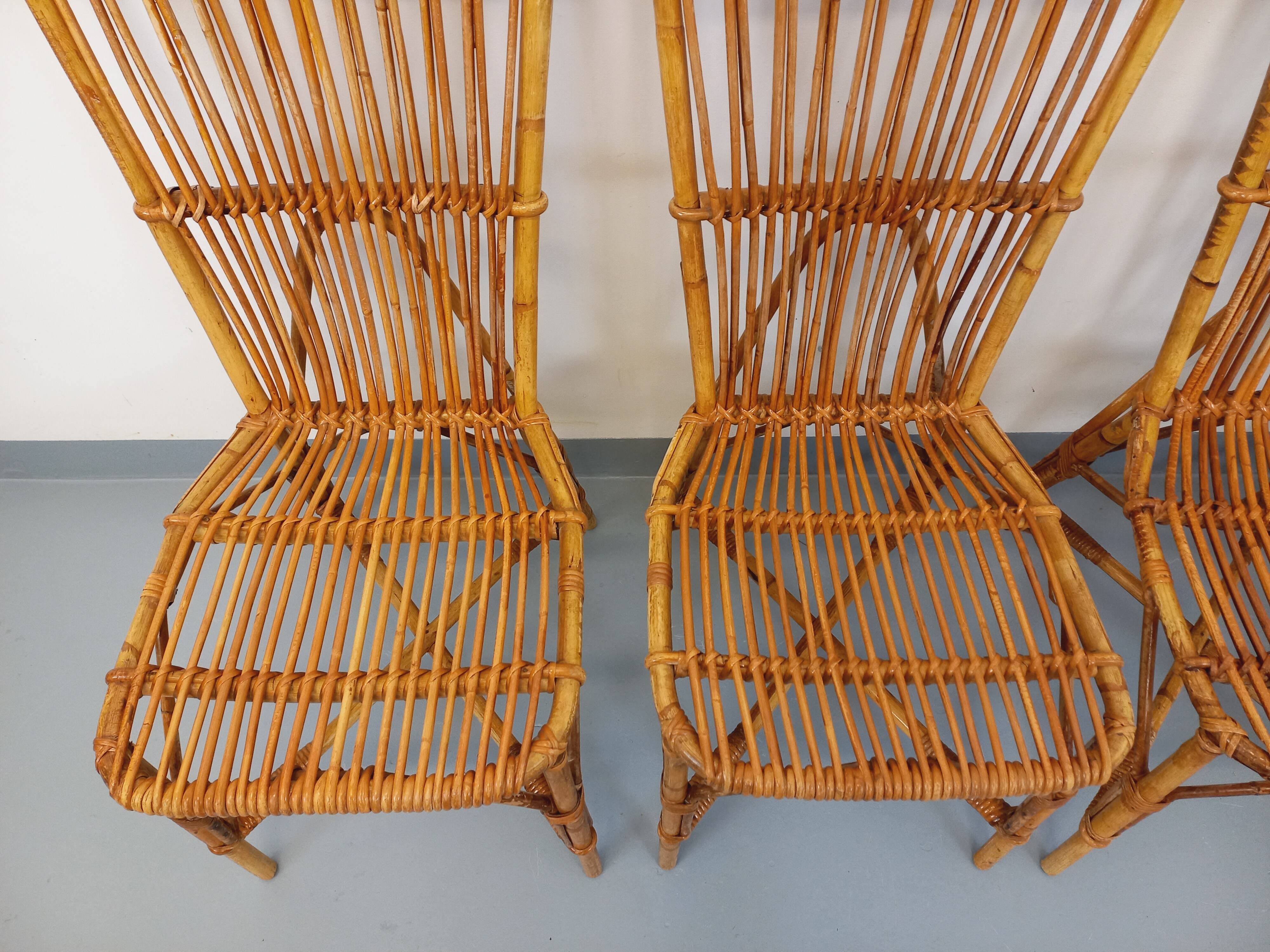 Set of 4 vintage Audoux Minet rattan chairs from the 1950s and 60s.