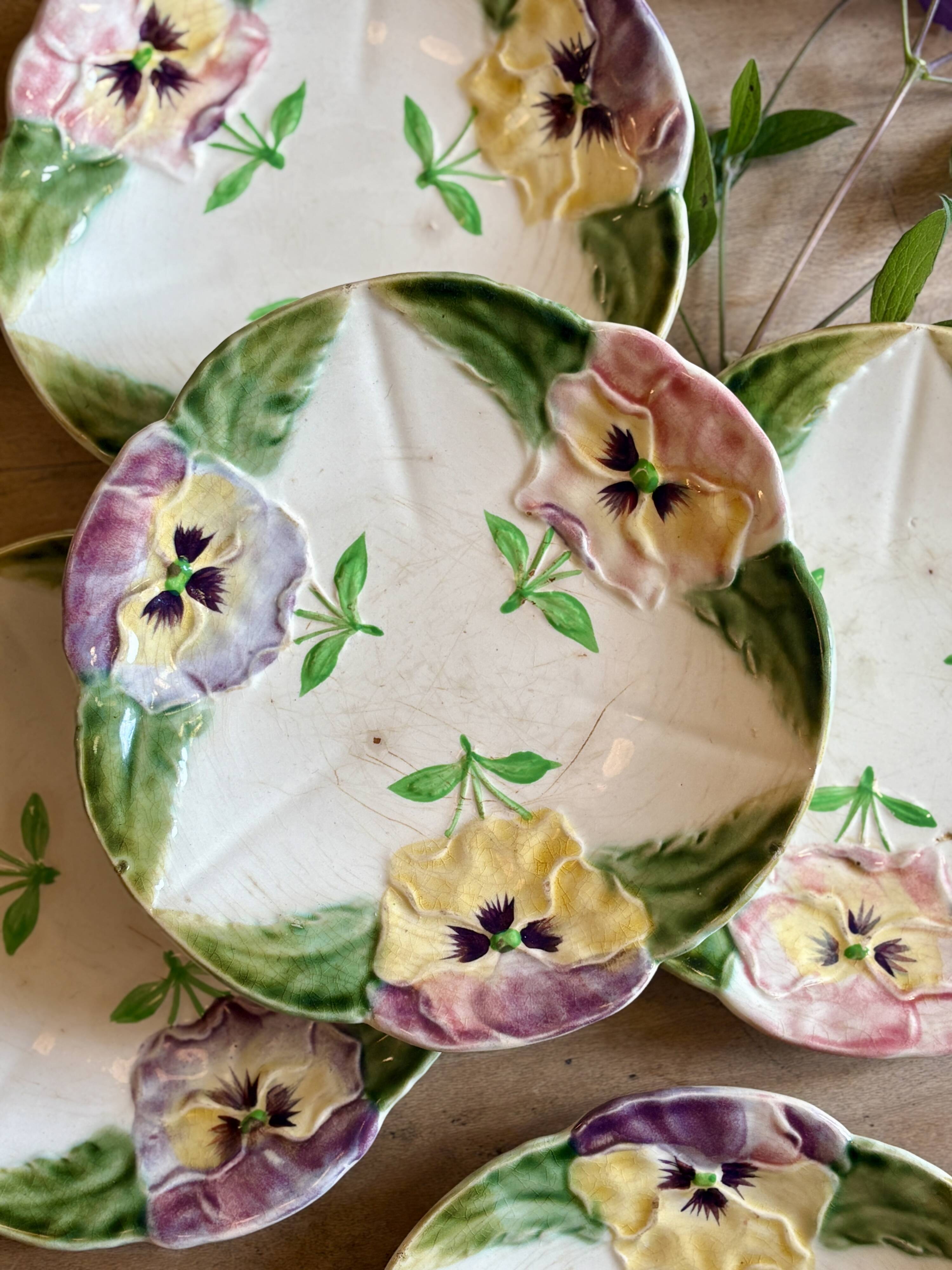 Set of 10 antique slip plates with flower decorations