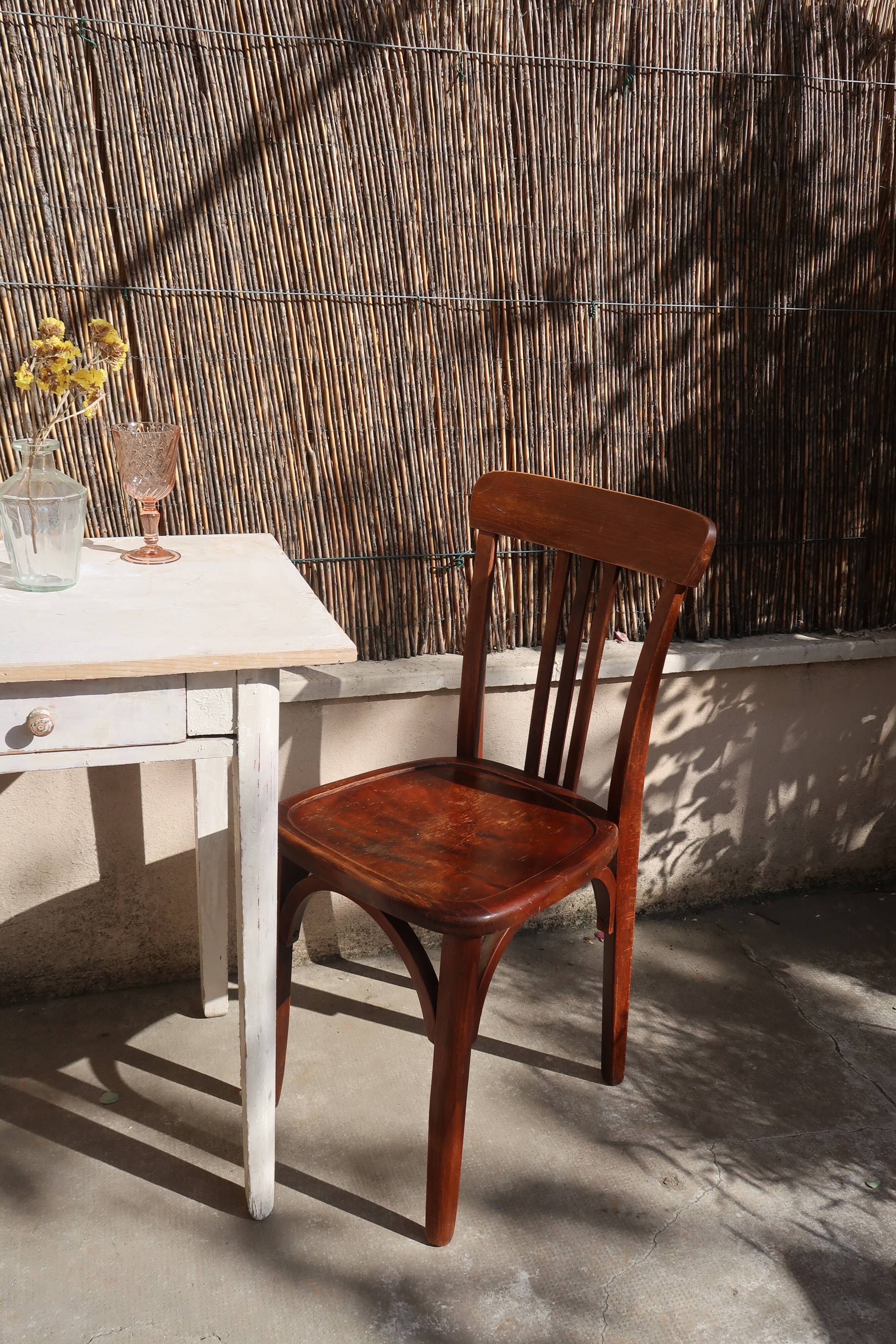 Pair of patinated bistro chairs
