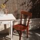 Pair of patinated bistro chairs