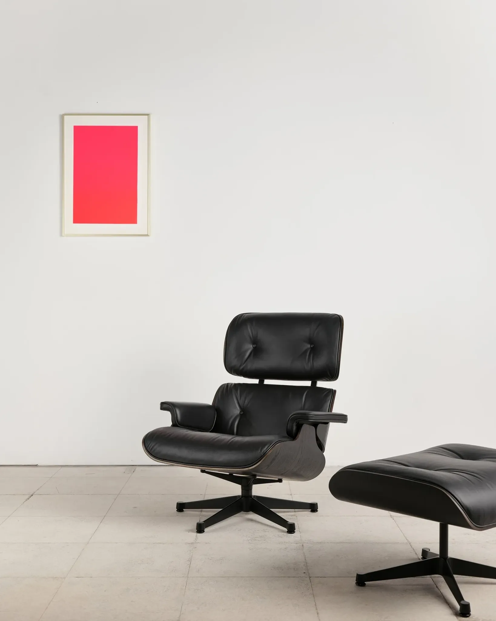 Lounge Chair and ottoman in black leather by Charles & Ray Eames, Vitra