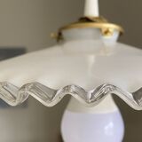 Old lampshade in white opaline glass with a wavy edge.