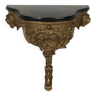 Console in gilded wood and black marble, scalloped shape, 19th century