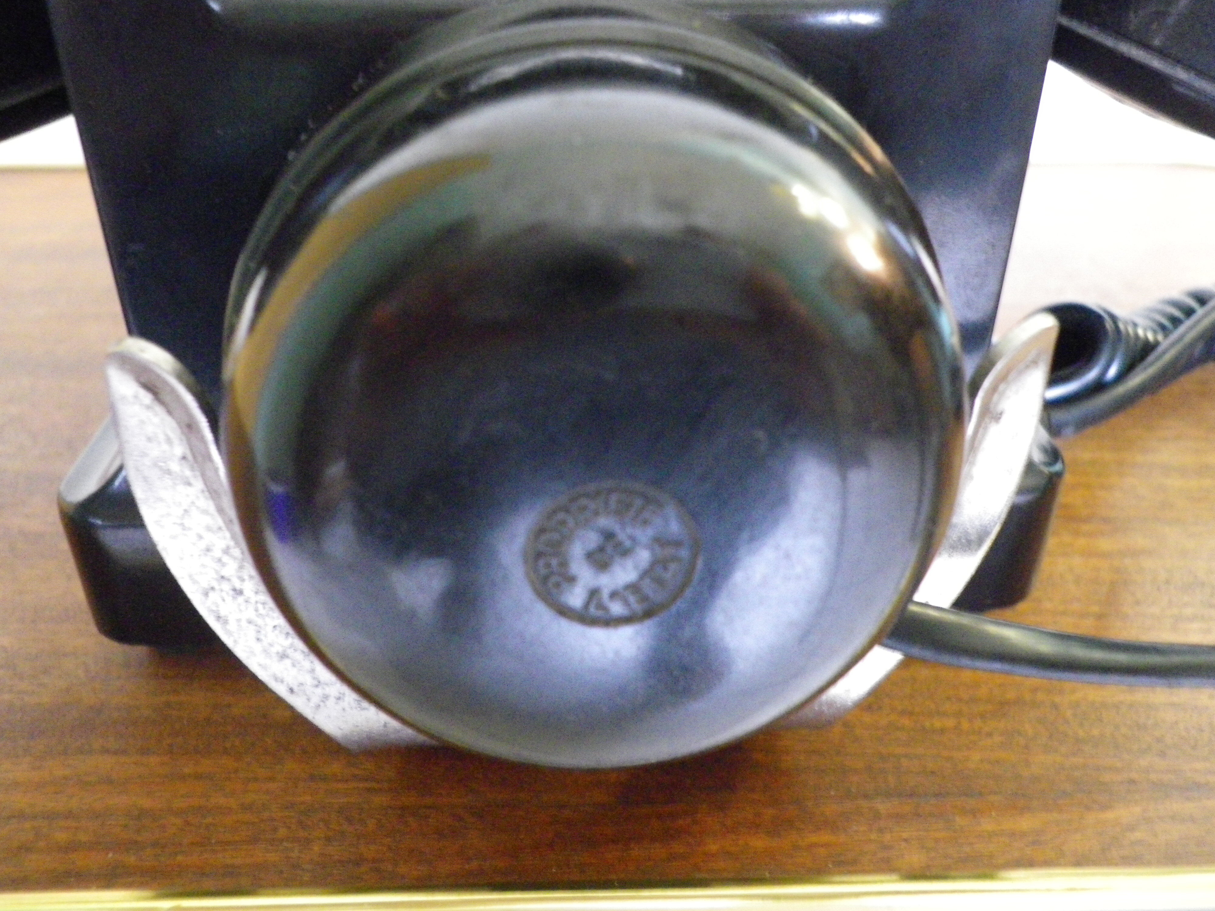 Black bakelite phone with earphone