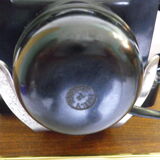 Black bakelite phone with earphone