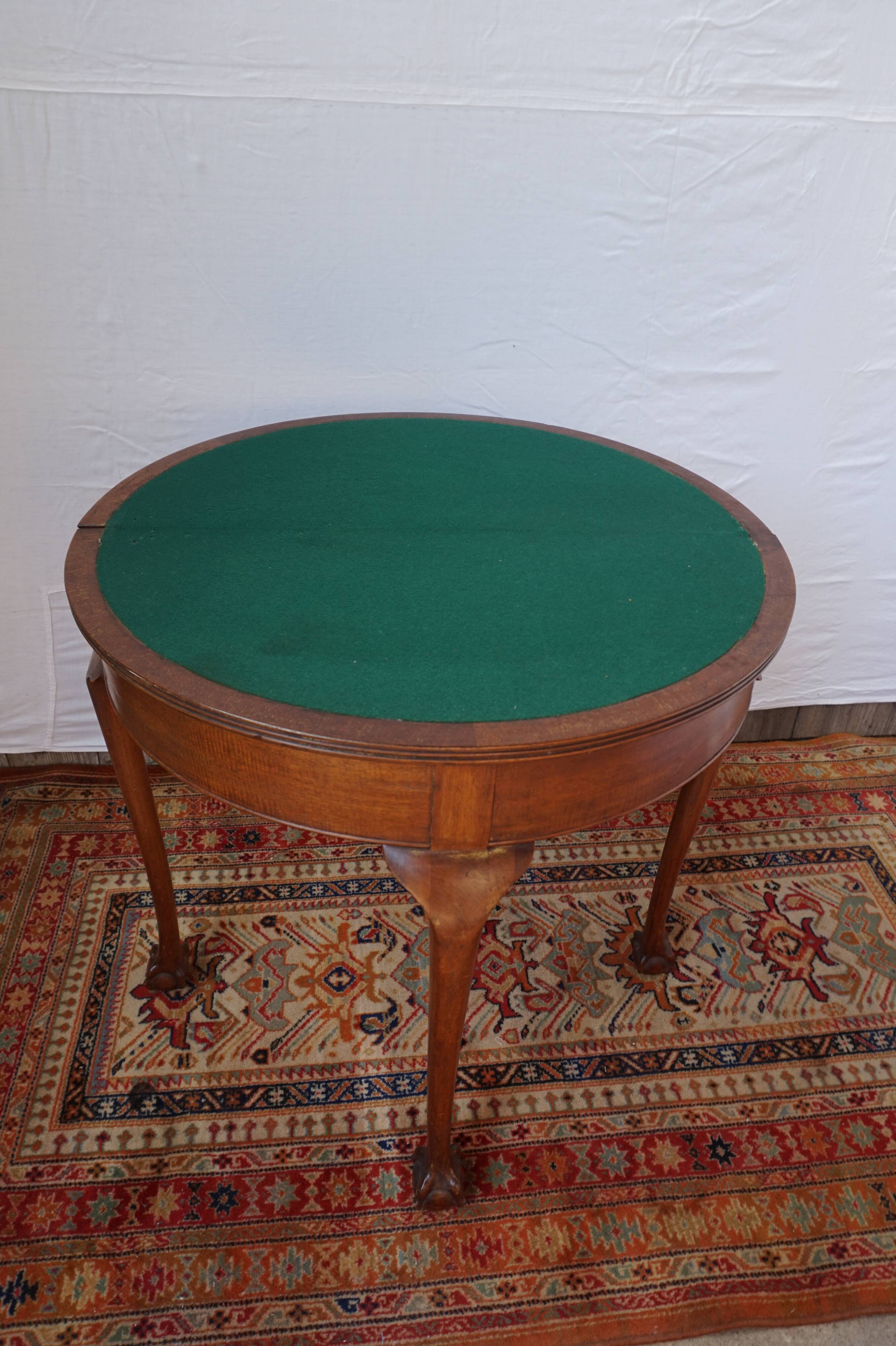 A half-moon english mahogany games table