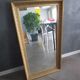 Large old mirror in wood and gilded stucco