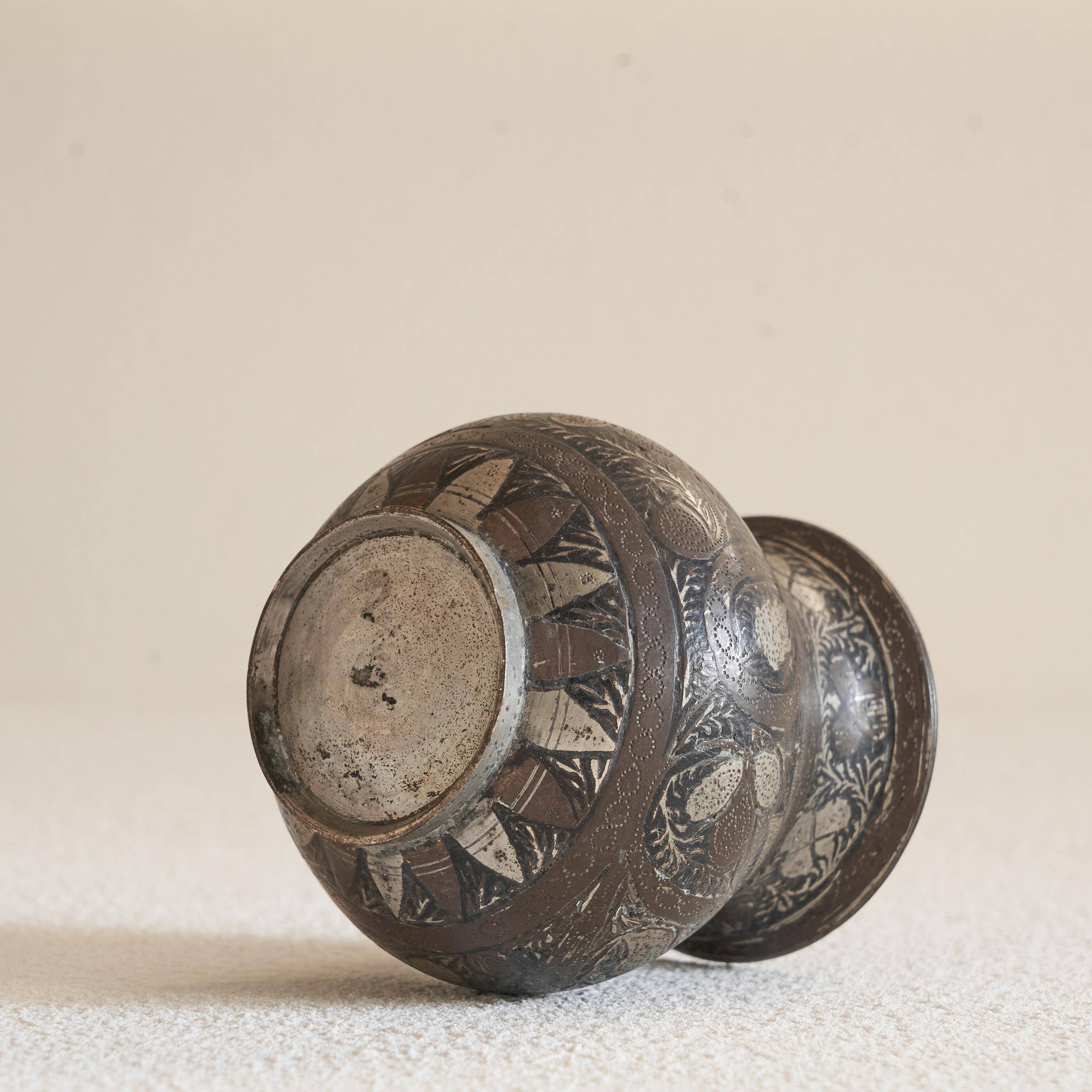 Antique pyriform Bidri vase in the shape of a pyramid.