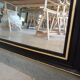 Miroir Napoléon III laqué noir et or 130 x 99cm