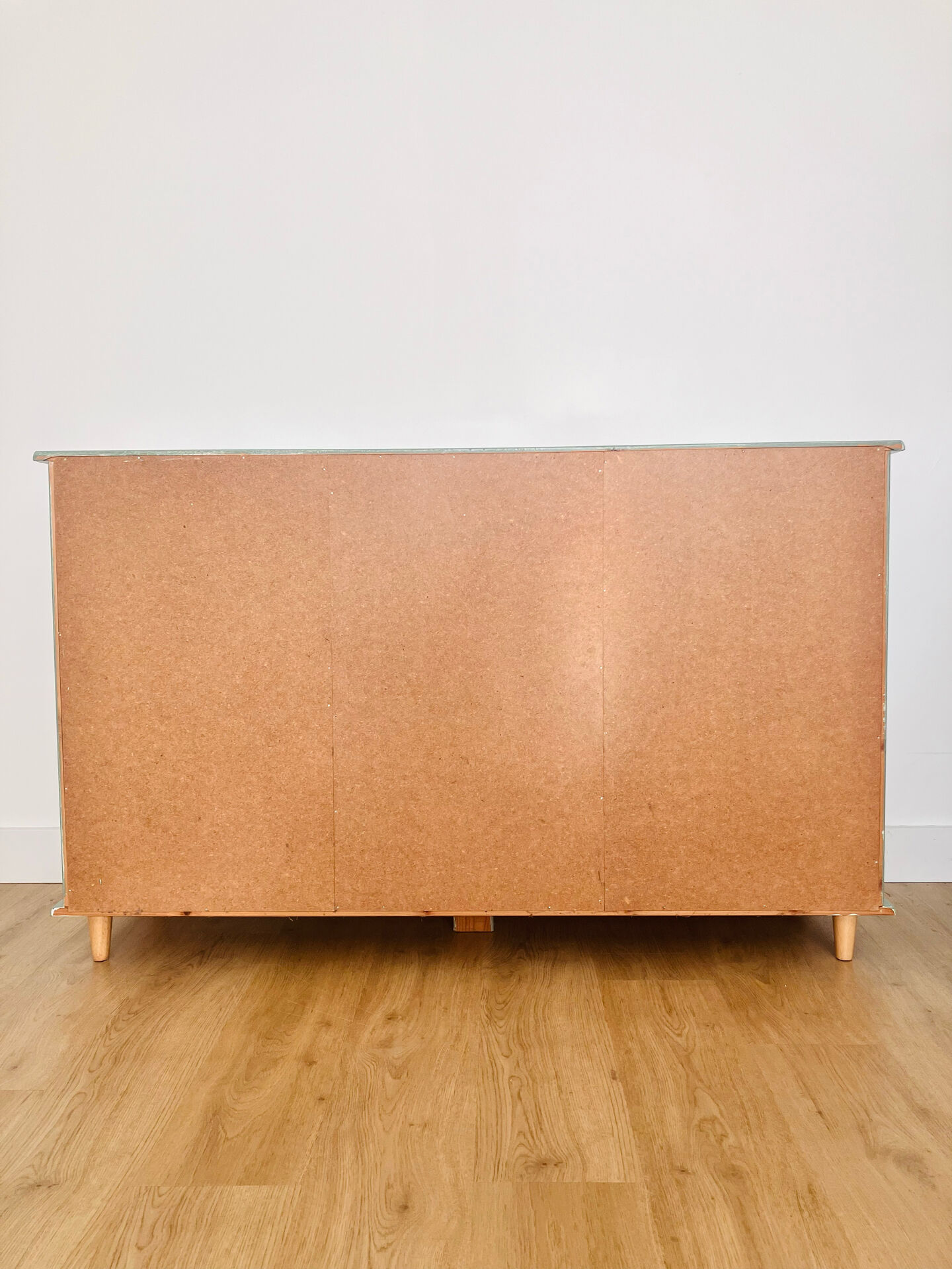 Low buffet with patinated gold handles.