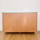 Low buffet with patinated gold handles.