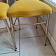 Pair of vintage golden designer chairs from the 50s