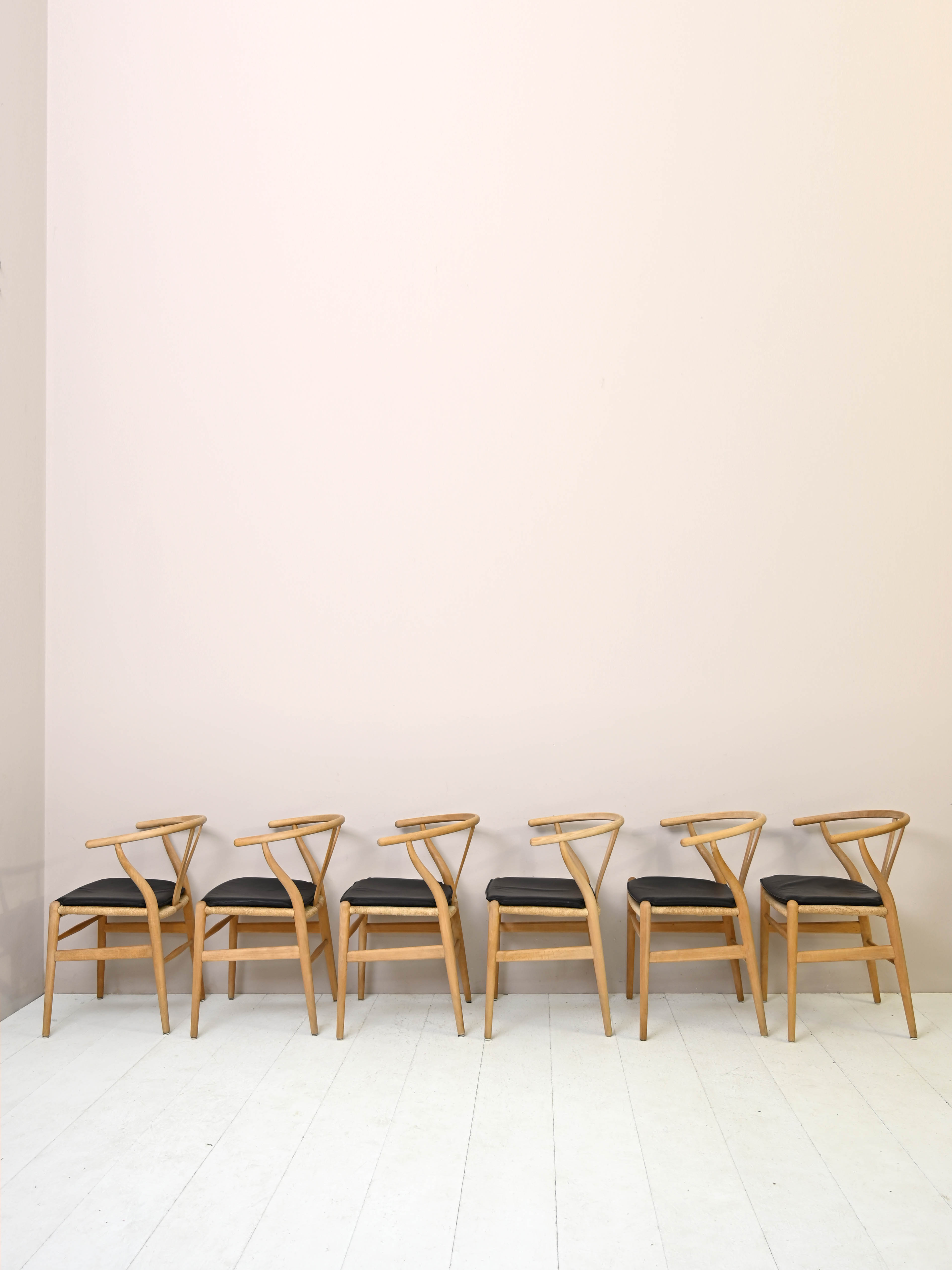 Set of six 'Wishbone chair' model chairs by Hans J. Wegner with leather cushions