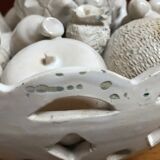Trompe l'oeil fruit cut in white earthenware by Jean Roger, circa 1960.