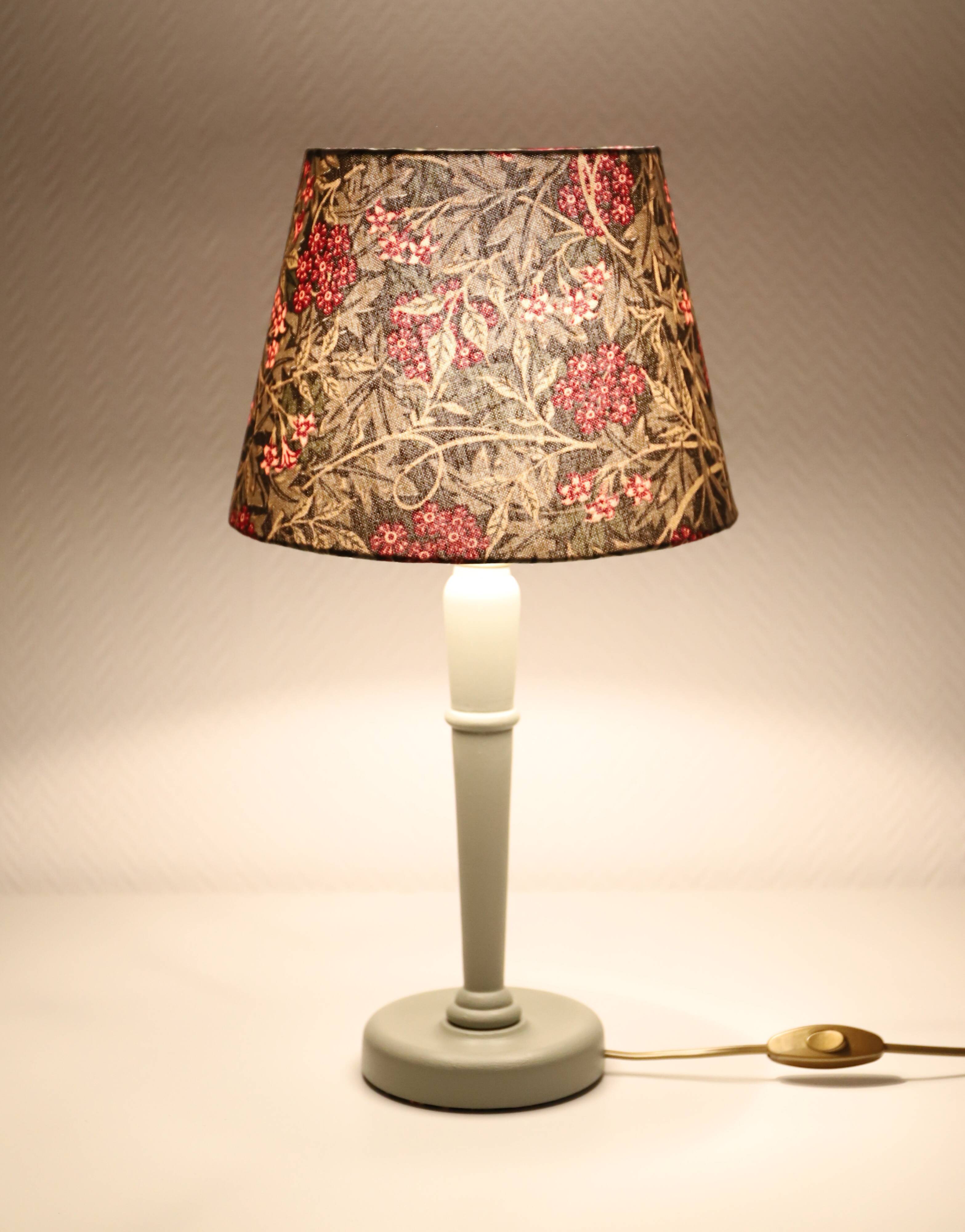 Table lamp, turned wooden base and antique printed lampshade