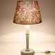 Table lamp, turned wooden base and antique printed lampshade