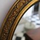 Oval gold mirror in Napoléon III style