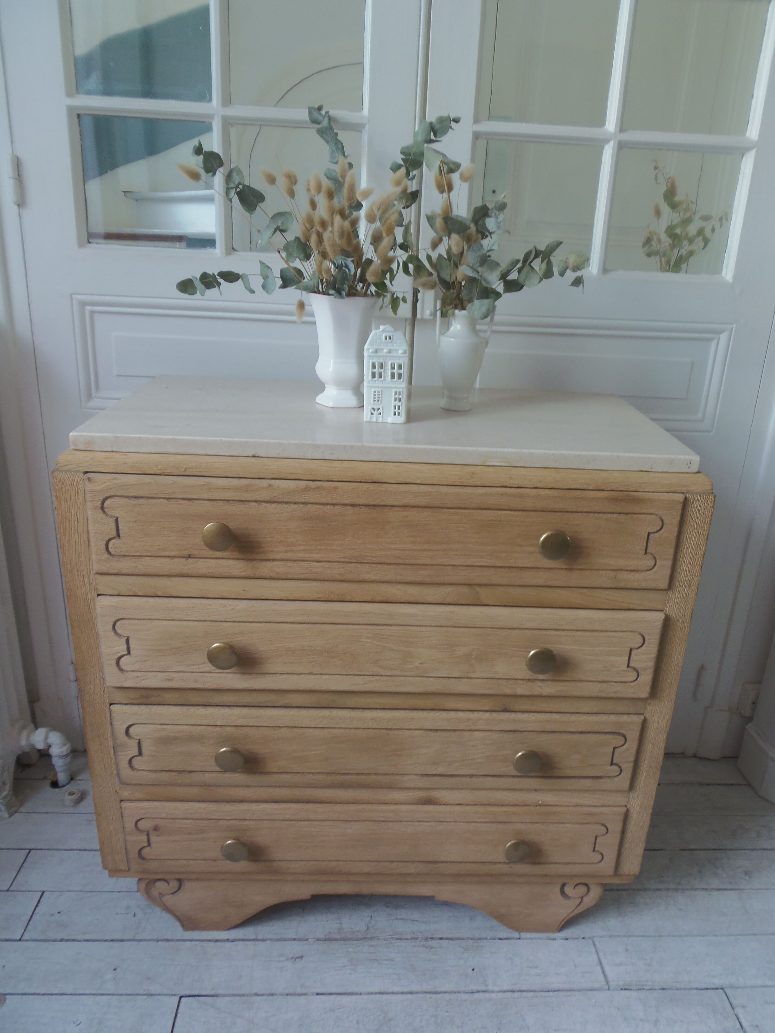 Vintage oak chest of drawers, a travertine plate laid for tray.