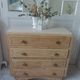 Vintage oak chest of drawers, a travertine plate laid for tray.