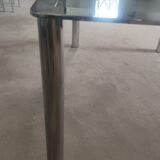 Dining table in chromed steel and smoked glass slab in 1969