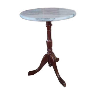 Pedestal table with marble top and wooden base