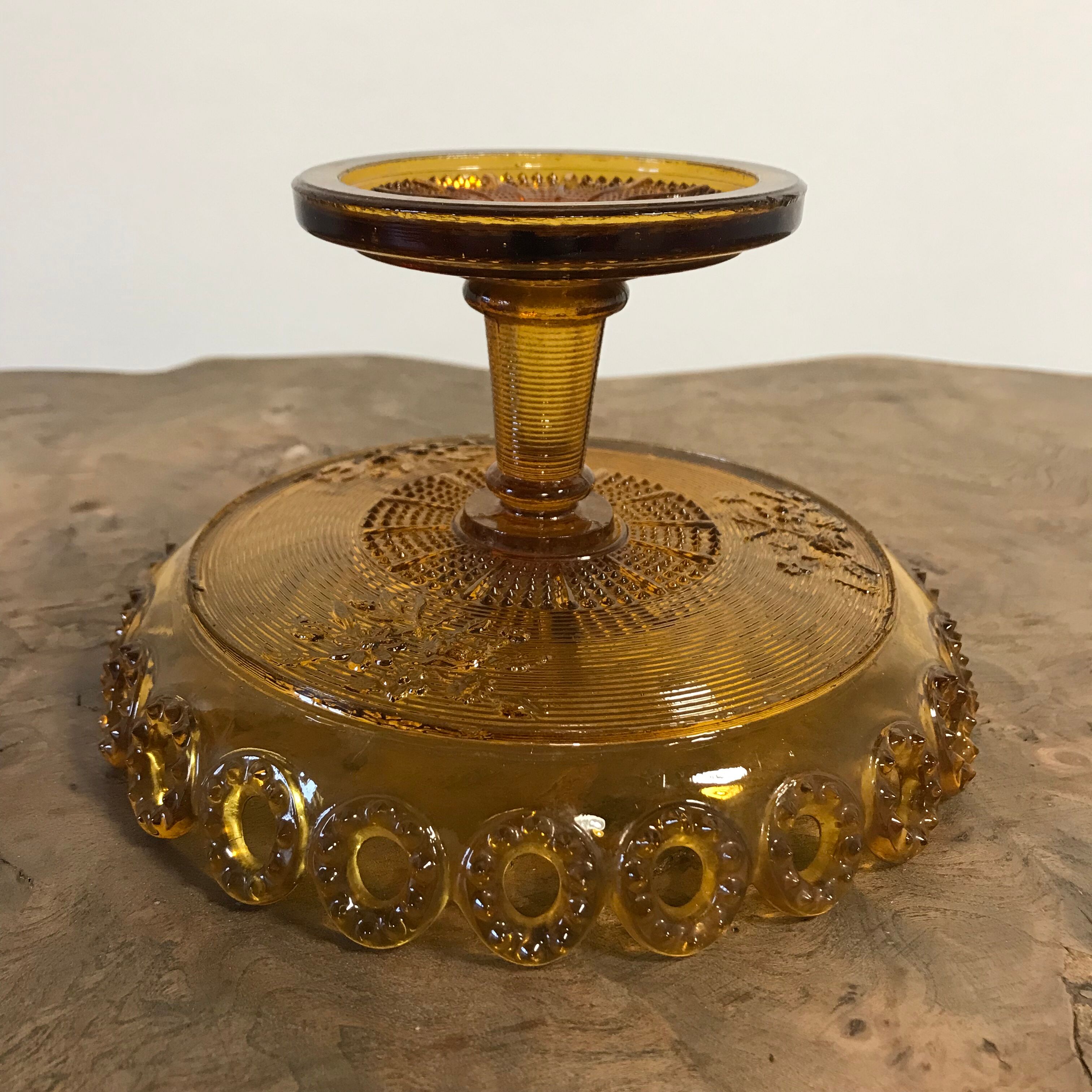 1900 fruit cup in amber pressed glass.