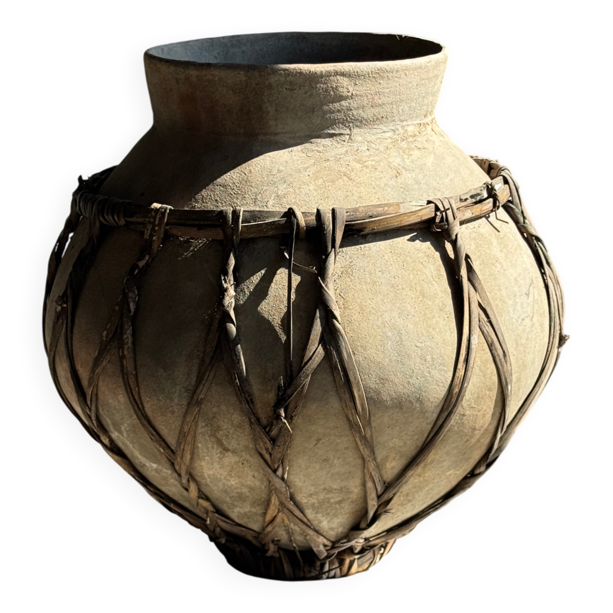 Very large light grey terracotta pot with handles and rattan crossbars.