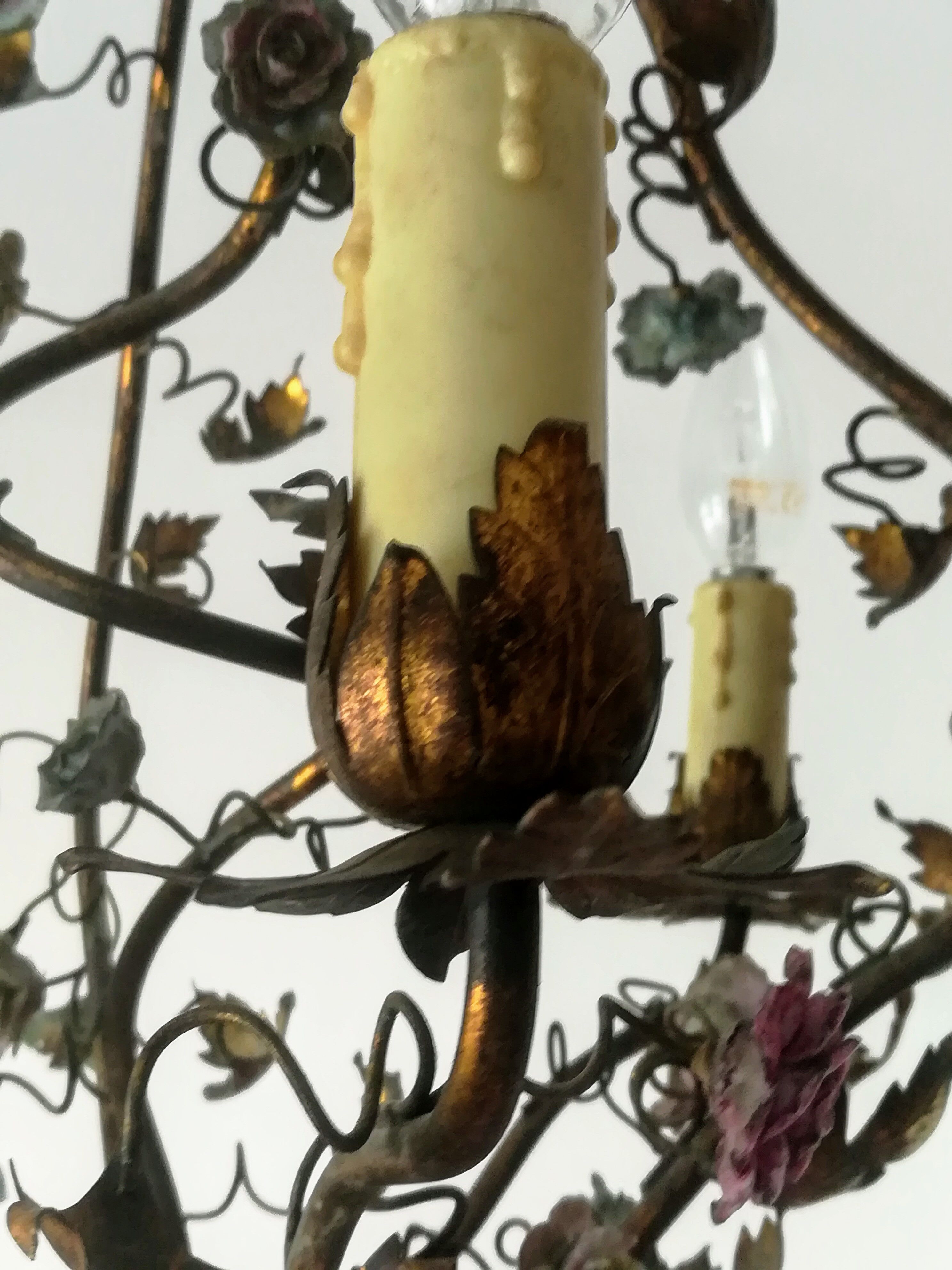 Brass chandelier and porcelain flowers