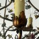 Brass chandelier and porcelain flowers