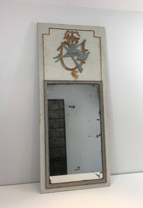 Louis XVI style mirror in patinated carved wood