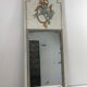 Louis XVI style mirror in patinated carved wood