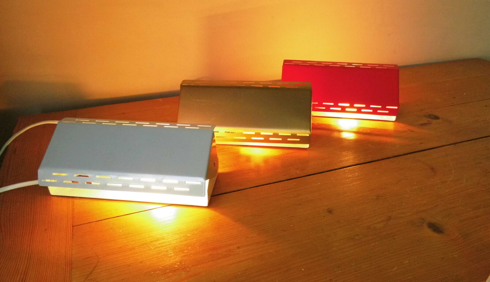 Wall lamp with red swivel shutter