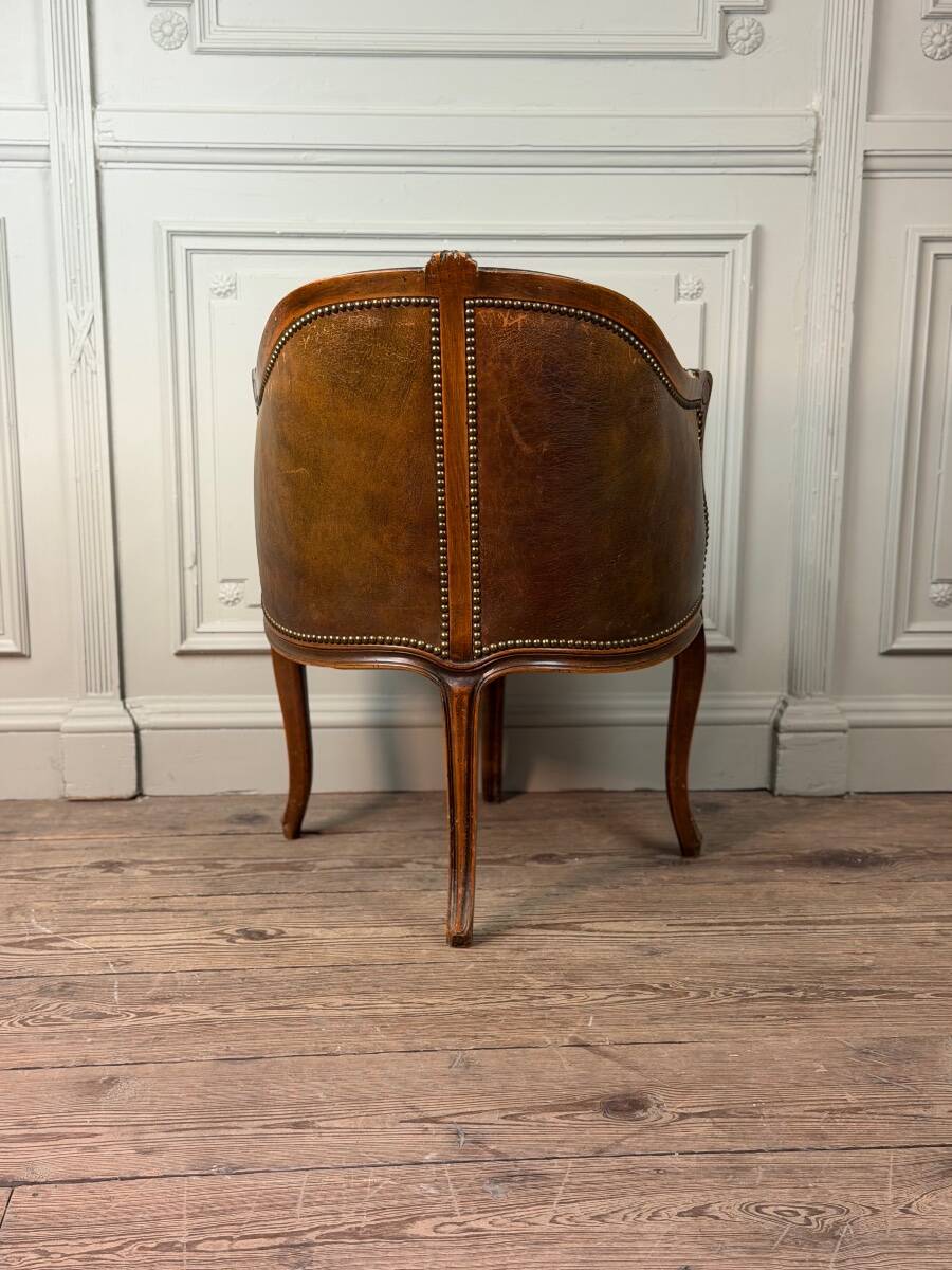 Louis XV style office chair in carved wood, brown leather, circa 1920.